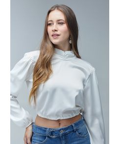Blusa manga larga cuello alto recogido en puños