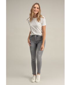 Jean reductor tiro alto con desgastes bota tubo